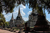 Ayutthaya, Thailand. Wat Phra Si Sanphet, the three main chedi with in the foreground the ruins of what remains of the surrounding gallery. 
